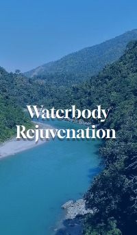 Turquoise river flowing through forested hills